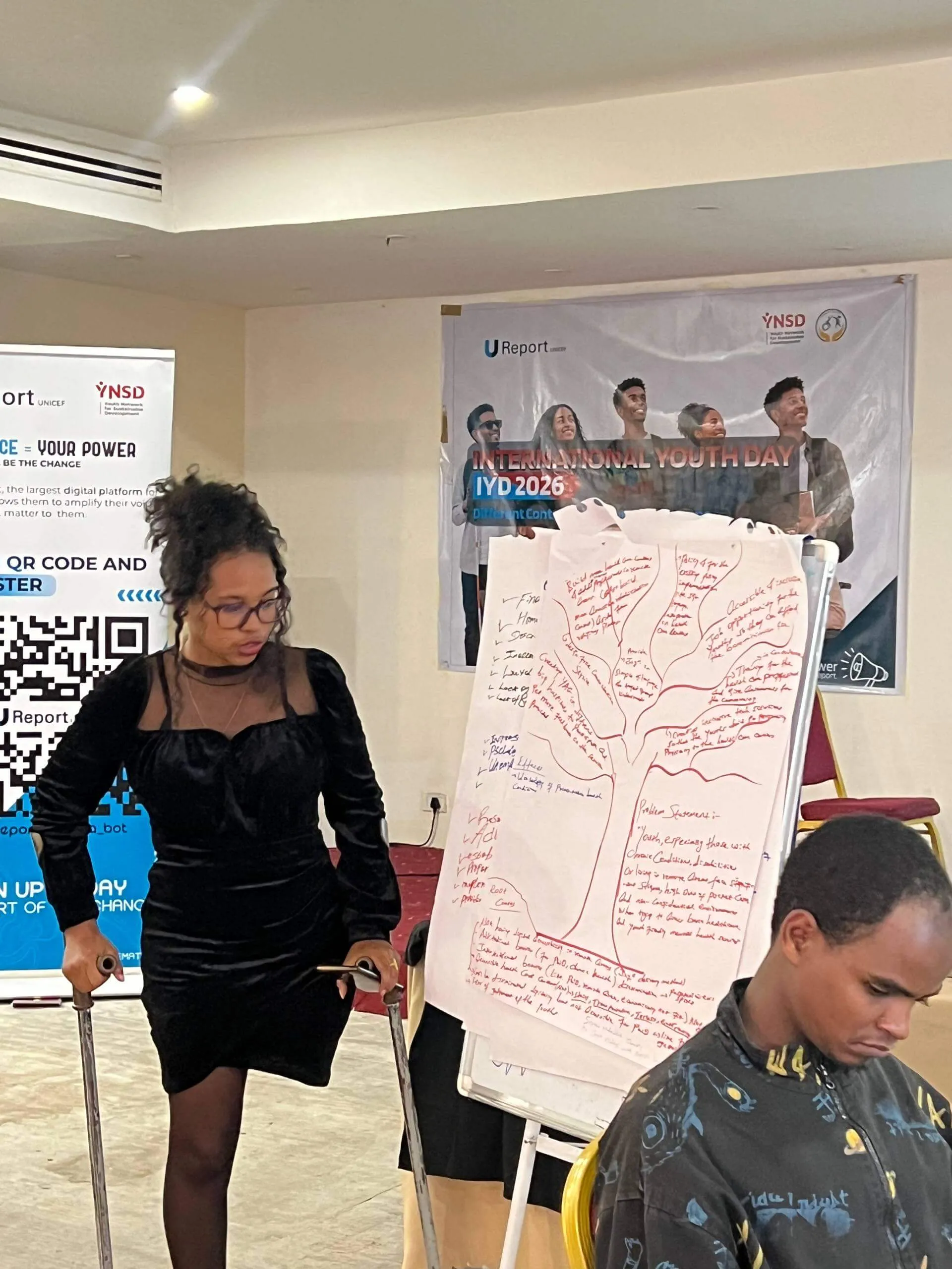 A young woman speaking at an Inclusive Growth workshop during International Youth Day
